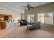 Open concept living room with access to the kitchen and an outdoor swimming pool at 760 W Douglas Ave, Gilbert, AZ 85233