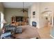 Open living room with a fireplace and TV cabinet at 760 W Douglas Ave, Gilbert, AZ 85233
