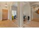 Spacious living room with wood floors and arches, creating an inviting space with natural light at 760 W Douglas Ave, Gilbert, AZ 85233