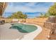 Backyard pool area featuring an in-ground kidney-shaped pool with desert landscaping at 760 W Douglas Ave, Gilbert, AZ 85233