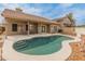 Backyard pool area featuring an in-ground kidney-shaped pool with desert landscaping at 760 W Douglas Ave, Gilbert, AZ 85233