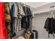 Bright walk-in closet featuring dual-level rods for clothing and upper storage shelves at 760 W Douglas Ave, Gilbert, AZ 85233