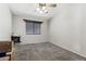 Bright bedroom features neutral carpet, closet and a window with blinds at 8014 W Ross Ave, Peoria, AZ 85382