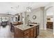 Open concept kitchen features an island, stainless steel appliances, and modern lighting at 8014 W Ross Ave, Peoria, AZ 85382