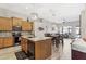 Well lit open concept kitchen area with eat in counter, and stainless appliances at 8014 W Ross Ave, Peoria, AZ 85382