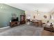 Cozy living room featuring gray carpet, built in bar and entertainment center at 8014 W Ross Ave, Peoria, AZ 85382