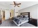 Spacious main bedroom features a ceiling fan, neutral colors, and adjacent bathroom at 8014 W Ross Ave, Peoria, AZ 85382