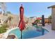 Resort style pool in landscaped yard featuring a rock waterfall feature at 8014 W Ross Ave, Peoria, AZ 85382