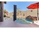 Private pool with rock waterfall features, lush landscaping, and ample space for outdoor enjoyment at 8014 W Ross Ave, Peoria, AZ 85382