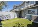 Backyard with climbing wall, artificial turf, patio cover, and privacy fence at 860 N Mcqueen Rd # 1028, Chandler, AZ 85225