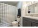 Cozy bathroom with dark cabinets, white countertop, and tiled floors at 860 N Mcqueen Rd # 1028, Chandler, AZ 85225