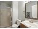 Tidy bathroom featuring a sink vanity, mirror, toilet, and a glass-doored shower at 860 N Mcqueen Rd # 1028, Chandler, AZ 85225