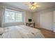 Bright bedroom features wood floors, a window, and closet space at 860 N Mcqueen Rd # 1028, Chandler, AZ 85225