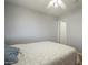 Bedroom featuring a ceiling fan, wood floors, and a comfortable bed at 860 N Mcqueen Rd # 1028, Chandler, AZ 85225