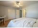 Cozy bedroom with a ceiling fan, wood floors, and closet space at 860 N Mcqueen Rd # 1028, Chandler, AZ 85225
