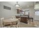 Cozy dining area connected to kitchen with a view of living room at 860 N Mcqueen Rd # 1028, Chandler, AZ 85225