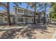Charming townhome featuring a well-maintained exterior, classic architecture, and inviting curb appeal at 860 N Mcqueen Rd # 1028, Chandler, AZ 85225