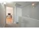 Bright upstairs hallway with carpet, closet, and doorway to an office space at 860 N Mcqueen Rd # 1028, Chandler, AZ 85225