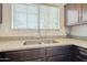 Close up of the kitchen sink features granite countertops and stainless steel faucet at 860 N Mcqueen Rd # 1028, Chandler, AZ 85225