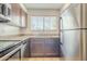 Stainless steel appliances, granite countertops, and tiled flooring in the kitchen at 860 N Mcqueen Rd # 1028, Chandler, AZ 85225