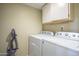 Convenient laundry area with modern washer and dryer for efficient chores at 860 N Mcqueen Rd # 1028, Chandler, AZ 85225