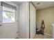 Laundry room featuring a door to outside, tile floors, and lots of storage at 860 N Mcqueen Rd # 1028, Chandler, AZ 85225