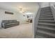Open-concept living room flows into dining area with plush carpeting and comfortable seating at 860 N Mcqueen Rd # 1028, Chandler, AZ 85225