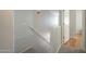 Clean stairway with carpeted steps, white walls, and a handrail at 860 N Mcqueen Rd # 1028, Chandler, AZ 85225