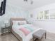 Cozy bedroom with pastel color scheme, modern lamps, ceiling fan, and bright decor at 8738 E Rose Ln, Scottsdale, AZ 85250