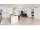 Open-concept kitchen boasts granite countertops, island seating, and seamless flow to the dining area at 8738 E Rose Ln, Scottsdale, AZ 85250