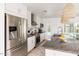 Well-lit kitchen features stainless steel appliances, granite countertops, and a view of the backyard pool at 8738 E Rose Ln, Scottsdale, AZ 85250