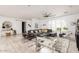 Spacious living room features modern furniture, a large window with natural light, and stylish decor at 8738 E Rose Ln, Scottsdale, AZ 85250
