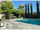 A refreshing pool and patio area perfect for relaxing and entertaining at 8738 E Rose Ln, Scottsdale, AZ 85250