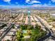 Wide aerial shot of a neighborhood featuring a park, basketball court, and single-Gathering homes at 9364 S Margo Dr, Tempe, AZ 85284