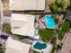 Aerial view of backyard with pool, spa, and lush landscaping in a residential neighborhood at 9364 S Margo Dr, Tempe, AZ 85284