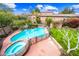 Aerial view of backyard featuring a pool, spa, and lush landscaping at 9364 S Margo Dr, Tempe, AZ 85284