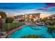 Inviting backyard featuring a large pool, spa, well-maintained lawn, and string lights for outdoor ambiance at 9364 S Margo Dr, Tempe, AZ 85284