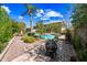 A backyard with pavers, plants, a fire pit, pool, and a two-story home at 9364 S Margo Dr, Tempe, AZ 85284