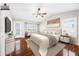Staged bedroom with vaulted ceilings, a ceiling fan, and a walkout to the backyard at 9364 S Margo Dr, Tempe, AZ 85284