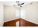 Comfortable bedroom featuring hardwood floors, a ceiling fan, and bright windows at 9364 S Margo Dr, Tempe, AZ 85284