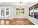 Bright dining area with backyard view via a large window and access to the patio at 9364 S Margo Dr, Tempe, AZ 85284