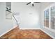 Ceramic tile flooring complements the dining room with a modern ceiling fan and lots of natural light at 9364 S Margo Dr, Tempe, AZ 85284