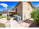 Exterior view of a home featuring a second story deck, manicured lawn, and mature landscaping at 9364 S Margo Dr, Tempe, AZ 85284