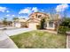Well-maintained home with a spacious driveway, two-car garage, and lush green lawn at 9364 S Margo Dr, Tempe, AZ 85284