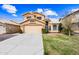 Charming two-story home with a well-manicured lawn, mature trees, and a welcoming front entrance at 9364 S Margo Dr, Tempe, AZ 85284