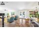 Staged living space boasts ceramic tile flooring, ample natural light, and a view of the backyard at 9364 S Margo Dr, Tempe, AZ 85284