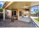 Covered patio area featuring brick pavers and outdoor seating offers a perfect spot for relaxation at 9364 S Margo Dr, Tempe, AZ 85284