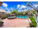 A pool and spa sit in a fenced backyard with desert landscaping and a two-story home at 9364 S Margo Dr, Tempe, AZ 85284
