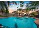 Backyard oasis with a sparkling pool, spa, privacy fence, and string lights for evening enjoyment at 9364 S Margo Dr, Tempe, AZ 85284