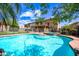 Inviting backyard pool and spa with secure fencing and lush greenery provides a private oasis at 9364 S Margo Dr, Tempe, AZ 85284